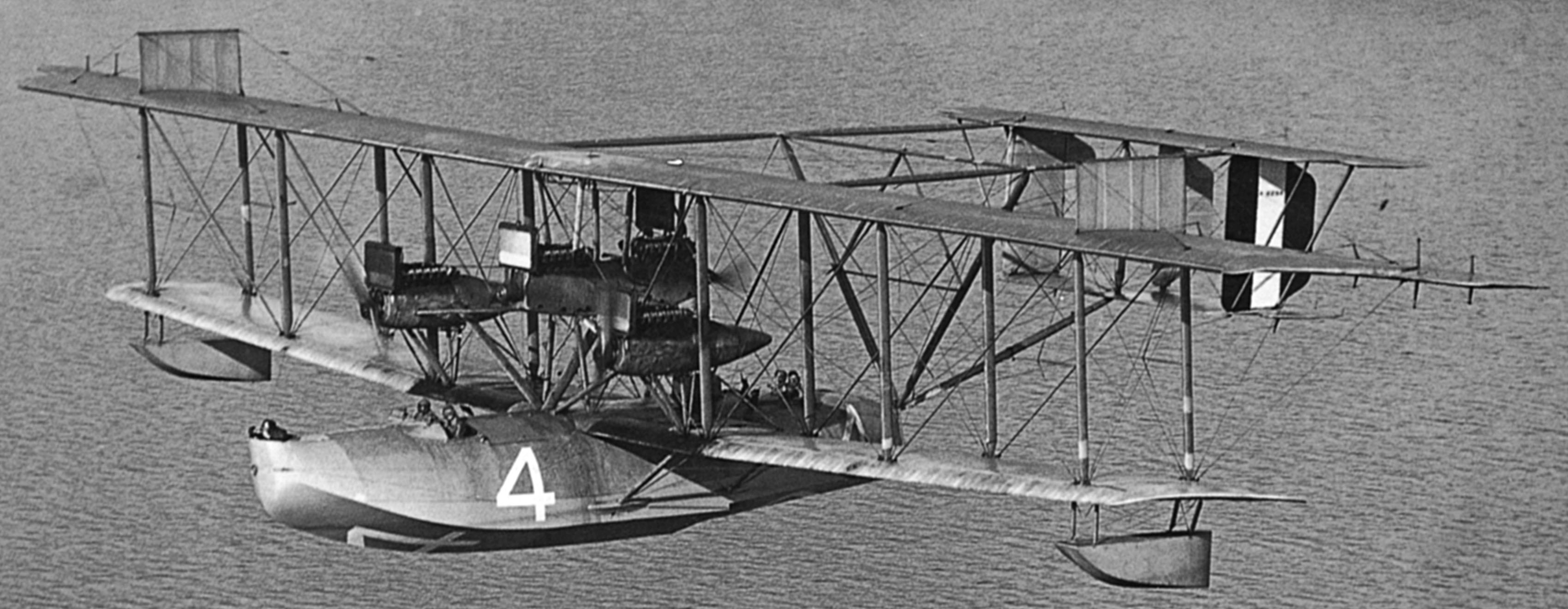 A rare photograph of NC-4 during flight operations. NC-4 had three forward-facing tractor engines and one center-mounted pusher engine. (Naval History and Heritage Command) A rare photograph of NC-4 during flight operations. NC-4 had three forward-facing tractor engines and one center-mounted pusher engine. (Naval History and Heritage Command)